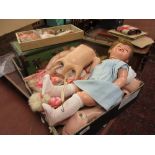 Vintage dolls trunk together with a quantity of dolls clothes,