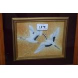 Framed enamelled silver foil picture of two cranes in flight and a framed floral watercolour,