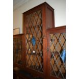 20th Century hardwood dwarf bookcase with leaded and coloured glass panelled doors