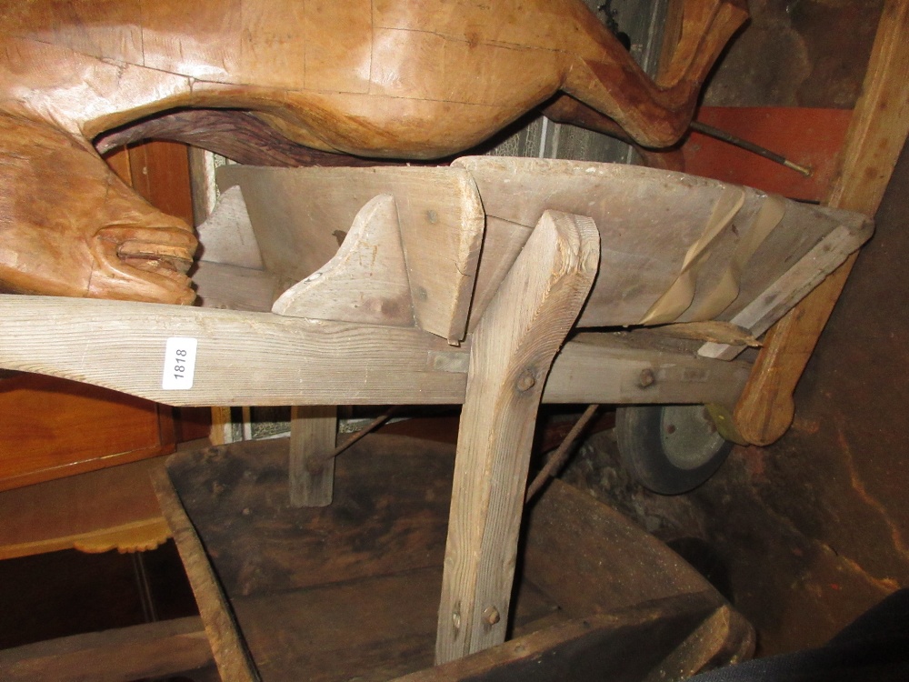 Early 20th Century wooden wheelbarrow with solid rubber wheel