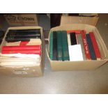 Two boxes containing a large collection of miscellaneous World stamps on sheets,