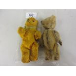 Miniature plush teddy bear with turning head and articulated body together with another similar