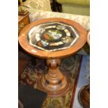 South American circular pedestal table with a glass inset top decorated with views of Rio de