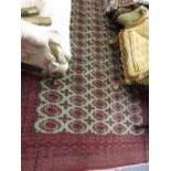 Indo Persian carpet of Tekke design with five rows of gols on a pale green ground with multiple