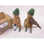 Pair of small Schuco tin plate clock work figures of children with a violin and a tankard having