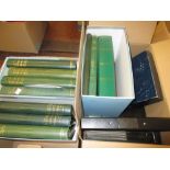 Two boxes containing a large collection of American stamps in seven green Simplex albums,