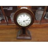 Edwardian mahogany and marquetry inlaid balloon shaped mantel clock with an enamel dial,