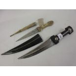 Dagger with horn handle with leather sheath and a brass and horn mounted dagger with wooden and