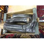 Two pairs of early 20th Century black leather riding boots with trees and pulls