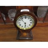 Edwardian mahogany line and lunette inlaid balloon shaped mantel clock with an enamel dial,