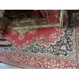 Machine woven Persian design rug with a medallion and plain design with borders