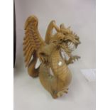 Large oriental carved hardwood figure of a dragon