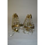 Pair of cut glass and brass bag form light fittings