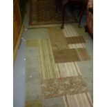 Modern design rug having green, cream and brown ground,