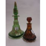 Miniature Bohemian amber glass decanter with stopper together with a similar green and gilt glass