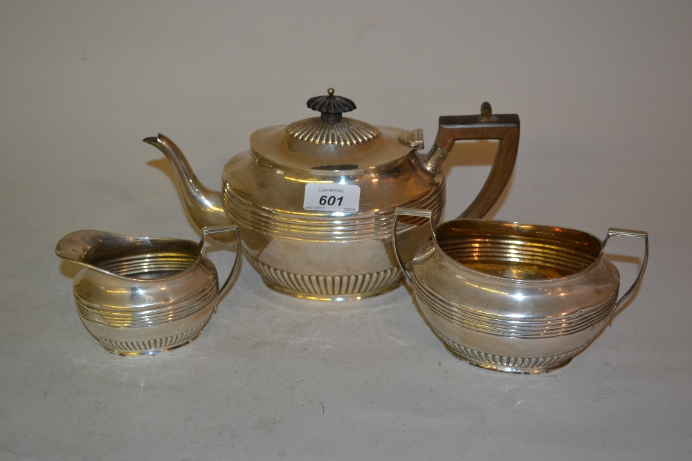 Early 20th Century Sheffield silver three piece tea service of oval reeded and gadrooned design,