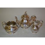 Victorian silver three piece tea service of circular squat baluster form with embossed floral