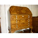 Art Deco figured walnut bureau with a fall front above three long drawers with Bakelite and metal