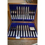 Oak cased set of twelve silver plated dessert knives and forks with mother of pearl handles