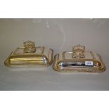 Two rectangular silver plated entrée dishes with covers and handles
