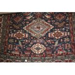 Ardebil rug with a triple medallion and all-over flower head and bird design on a blue ground with