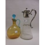 Glass claret jug with plated mounts together with an amber tinted glass jug with stopper