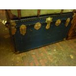 Large blue travel trunk with leather carrying handles