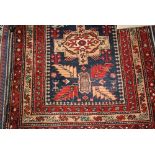 Caucasian style runner with multiple medallion design on blue ground with borders,