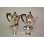 Sheffield silver four piece tea service of circular faceted design, the teapot,