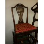 Set of four George III mahogany pierced splat back dining chairs with red damask upholstered