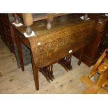 Early 19th Century oak drop-leaf Pembroke table on square tapering supports,