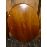 Victorian oval walnut marquetry inlaid tilt top table on four turned column base with carved