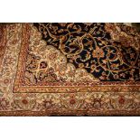 Kashan style machine woven blue ground carpet, 1.90 x 1.