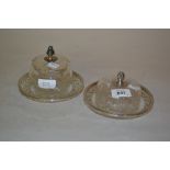 Two white metal mounted cut glass bowls with similar saucers