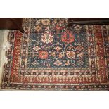 Pair of machine woven Persian design rugs with an all-over stylised design on blue ground with