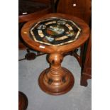 South American circular pedestal table with a glass inset top decorated with views of Rio de