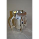 Edwardian silver trophy vase of rocket design with a square tapering body on stylised supports,