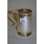 Silver trophy mug of plain tapering form with scroll handle,