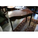 George III mahogany serpentine fronted fold-over card table with floral painted decoration raised