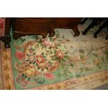 Chinese carpet with embossed floral design on a beige ground,