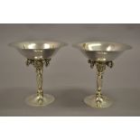 Pair of Georg Jensen sterling silver tazzas of cast grapevine design on wrythen stems with London