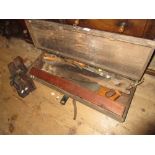 Carpenters wooden tool box containing various saws together with three various woodworking planes