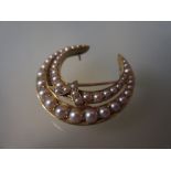 Victorian gold and pearl set double crescent brooch