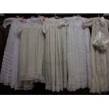 Six various Christening gowns with bonnets