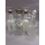 Pair of modern cut glass decanters with silver collars,