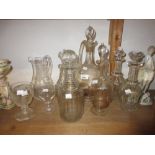 Six various 19th Century glass decanters with stoppers together with a glass jug and two glass
