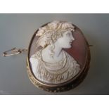 19th Century carved shell cameo portrait brooch in a yellow metal mount