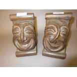 Pair of Arts and Crafts carved mask head oak bookends