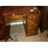 19th Century mahogany twin pedestal desk of nine drawers with brass ring handles raised on plinth