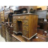 Mid 20th Century mahogany kneehole desk in George III style with a green leather inset top